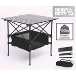 Black portable folding camping picnic table set up outdoors