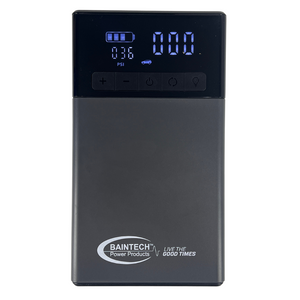 Compact emergency battery jump starter with integrated pressure gauge